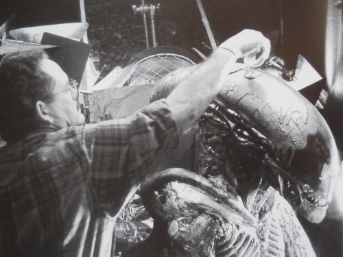 Covering the suit in the lead mixture.